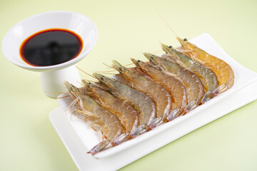 Fresh shrimps neatly arranged on a white tray