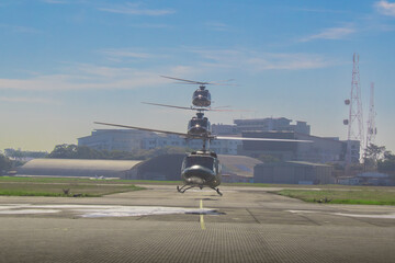 bell 212 and bell 412 helicopters in flight hovering together as a formation