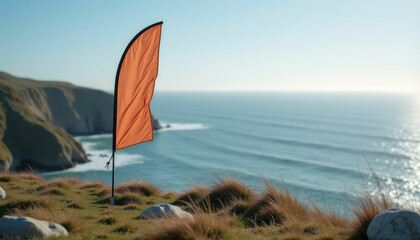 Fototapeta premium Flag banner mockup. Orange flag banner mockup on seaside cliff background