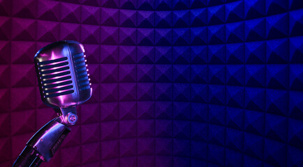 Vocal microphone in recording studio with acoustic foam background for podcast or radio broadcast...