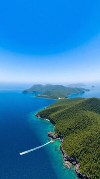 Aerial view from height of ocean with islands under a sunny sky - Equirectangular 360 degree loop video