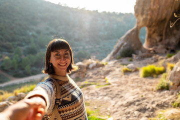 follow me. happy couple traveling. portrait of happy female tourist in mountains. girl smiling. trekking and hiking. girl with backpack.