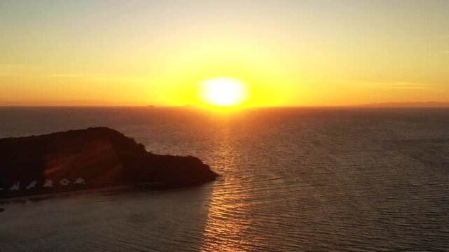 Bright rising sun over Tokoriki island in Fiji &ndash; scenic aerial panorama of Pacific 4k.
