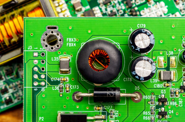 Close-up of a printed circuit board with electronic components, the image symbolizes progress and...