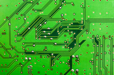 Close-up of a printed circuit board with electronic components, the image symbolizes progress and...