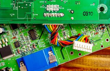 Close-up of a printed circuit board with electronic components, the image symbolizes progress and...