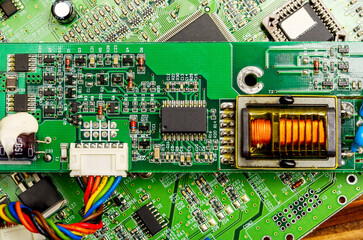 Close-up of a printed circuit board with electronic components, the image symbolizes progress and...