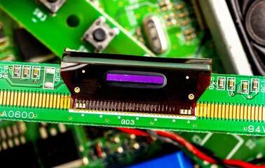 Close-up of a printed circuit board with electronic components, the image symbolizes progress and...