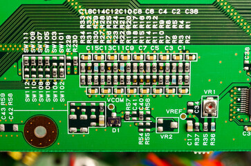 Close-up of a printed circuit board with electronic components, the image symbolizes progress and...