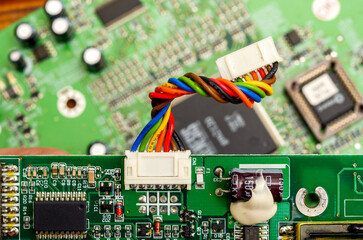 Close-up of a printed circuit board with electronic components, the image symbolizes progress and...