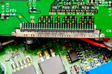 Close-up of a printed circuit board with electronic components, the image symbolizes progress and...