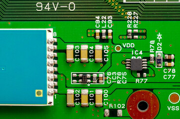Close-up of a printed circuit board with electronic components, the image symbolizes progress and...