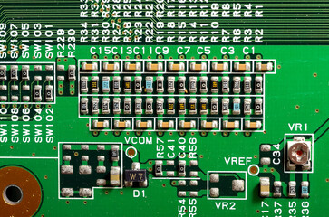 Close-up of a printed circuit board with electronic components, the image symbolizes progress and...