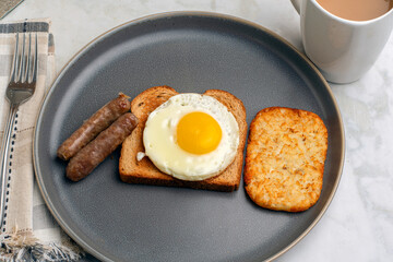 fried egg on toast  with breakfast links