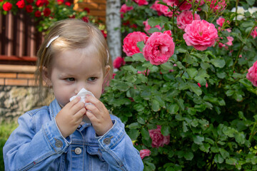 little girl allergic to roses. Selective focus