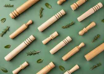 Rolling Pins and Botanicals: A neatly arranged collection of natural wooden rolling pins is interspersed with fresh green botanicals on a vibrant, eye-catching background.
