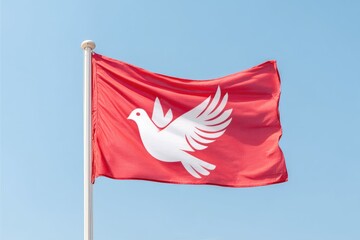 Waving Red Flag With a White Dove Symbol Against a Clear Blue Sky