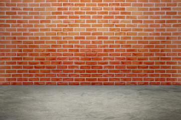 An empty room with red brick walls. The red brick walls create a warm atmosphere.