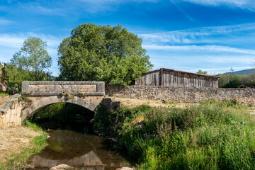 Historic Stone Arch Bridge and Rustic Building in Vinuesa Countryside, Soria, Castile and Leon,...