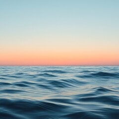 Obraz premium Serene Ocean Waves at Sunset with Calm Blue Sky and Gentle Colors