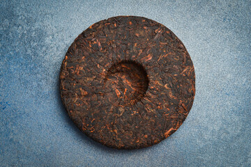 Fermented Pu-erh tea disc. Chinese traditional drink.
