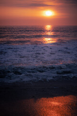 Sunset Over the Pacific Ocean – Warm Light Reflecting on the Water Surface