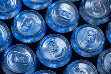 Top view of closed aluminum cans in beer factory setting