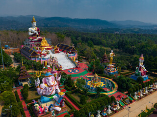 Wat sang kaew buddhist temple complex in chiang mai, Thailand with deity statues and scenic views