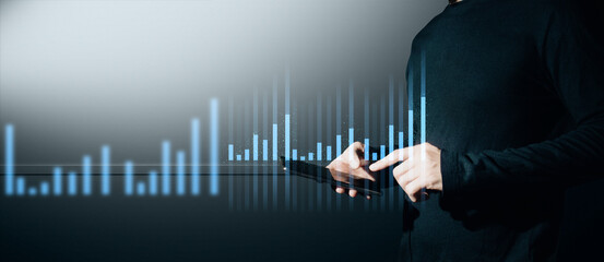 hand of businessman interactive touching a holographic of transaction financial network data...