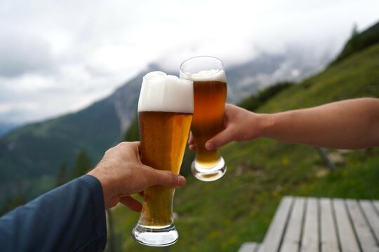 glass of beer in hand on a mountain hut in Werfenweng, Salzburg