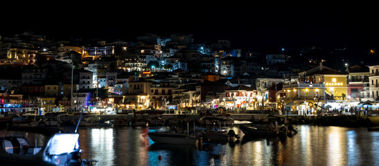 Fototapeta premium Panoramic View of Parga Harbor and Town at Night
