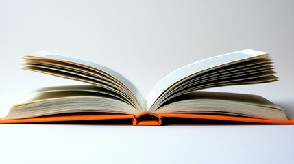 Open book, orange cover, pages fanned