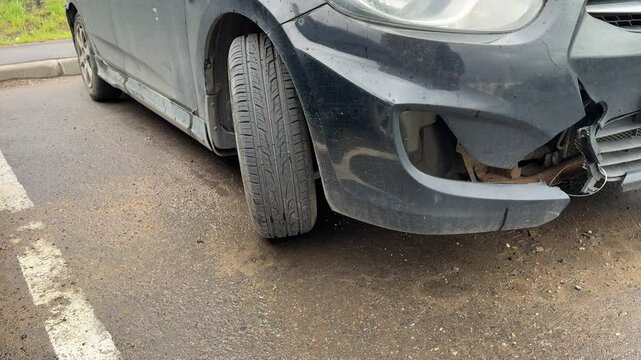 The car was seriously damaged as a result of a recent collision and a traffic accident. This close-up image shows a car with extensive damage to the front as a result of a serious accident.