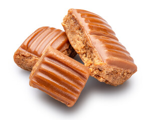 Caramel sweets or butterscotch fudge on white background. File contains clipping path.