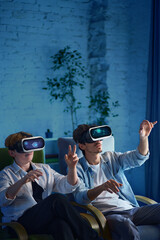 Two people, family enjoy a virtual reality adventure using VR headsets in a modern living room....