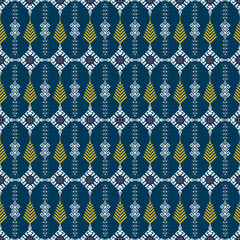 A detailed geometric textile pattern with blue, yellow, white, and purple colors, featuring symmetrical motifs resembling wheat stalks and diamond shapes.