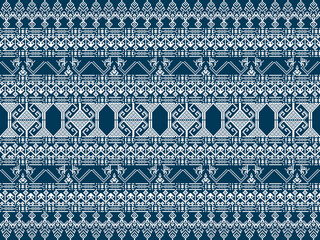 A detailed geometric textile pattern in navy blue and cream, featuring intricate symmetrical designs and ornamental motifs.