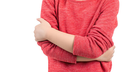Close up of a child wearing a red shirt, crossing their arms across their chest, conveying feelings of unease, anxiety, or defensiveness, isolated on a transparent background