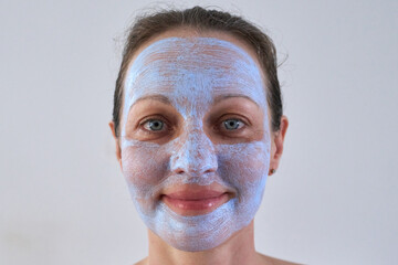 Portrait of woman with healing mask on her face.