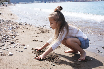 little cute girl on beach, lifestyle people concept