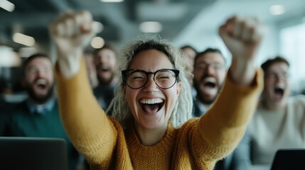 A group of joyful individuals celebrates success in an office setting, radiating enthusiasm and unity, symbolizing teamwork, commitment, and the thrill of achievements together.