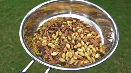 Indian Whole Spices dry roasted to make powder which can be used as Tea masala powder. Aromatic mix of various whole spices in stainless steel pan
