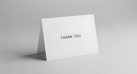 Minimalist thank you card displayed on a neutral background.
