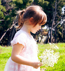 little cute girl picking up flowers, lifestyle people concept