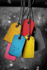 Set of colored safety tags used in industrial zones, highlighting distinct hues and textures for identification purposes