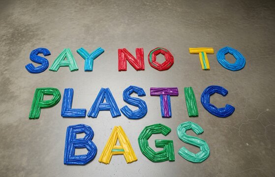 Anti-waste design featuring “Say No to Plastic Bags” in handmade letters from plastic waste, shared for International Plastic Bag Free Day.