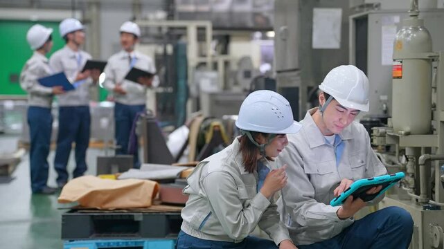 Group of workers working in a factory