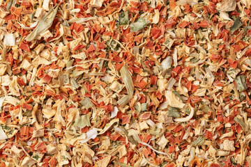 Dried vegetables seasoning. Dry cut and chopped up vegetables mix. Natural spices on white...