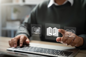 E-library and E-learning Concept, Person using laptop with virtual E-Book icons for online knowledge Base, Digital library, Access electronic books on Internet. Course education. Webinar technology.