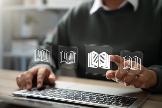 E-library and E-learning Concept, Person using laptop with virtual E-Book icons for online knowledge Base, Digital library, Access electronic books on Internet. Course education. Webinar technology.